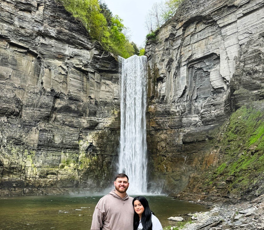 Taughannock Falls, a tall single-drop waterfall in Taughannock Falls State Park, surrounded by steep cliffs.
